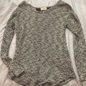 Small, Free Kiss black and white long sleeve, lace in the back.